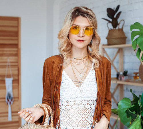 fashionable woman wearing stylish outfit with yellow sunglasses