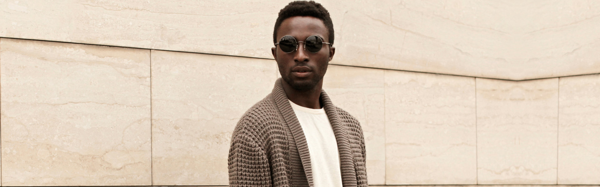 man wearing brown cardigan and sunglasses