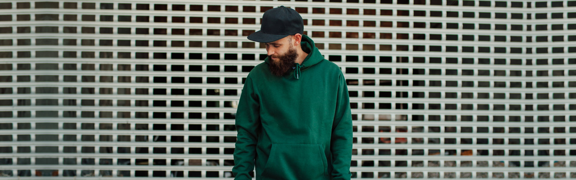 man wearing a green hoodie