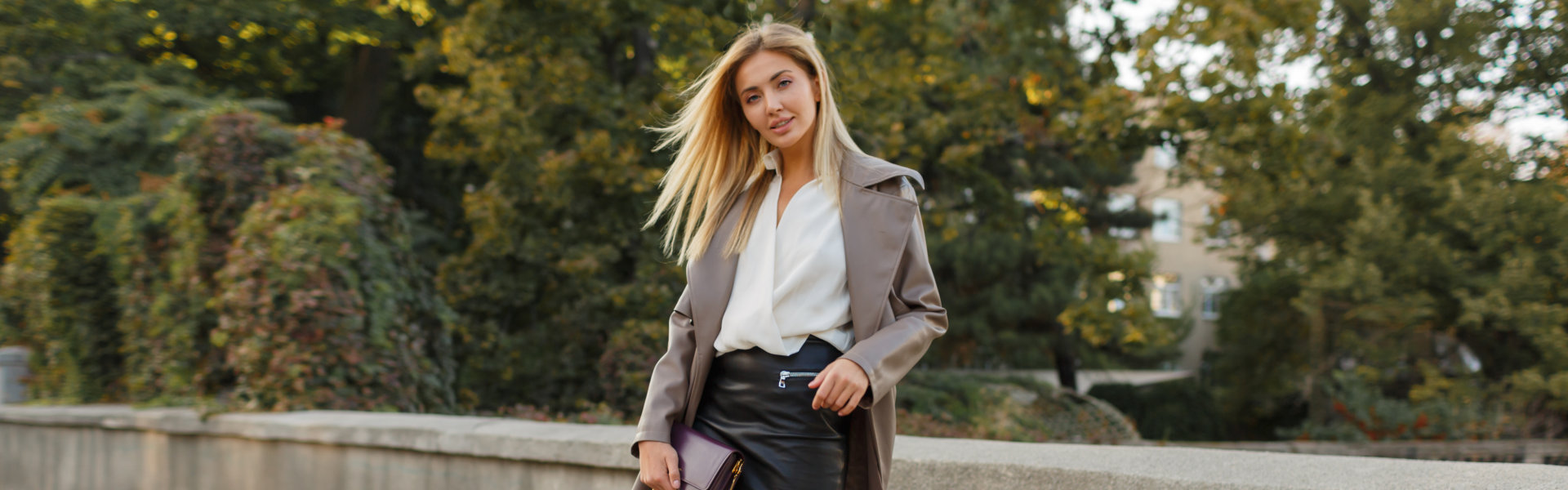 woman in stylish luxury beige leather coat and high heels